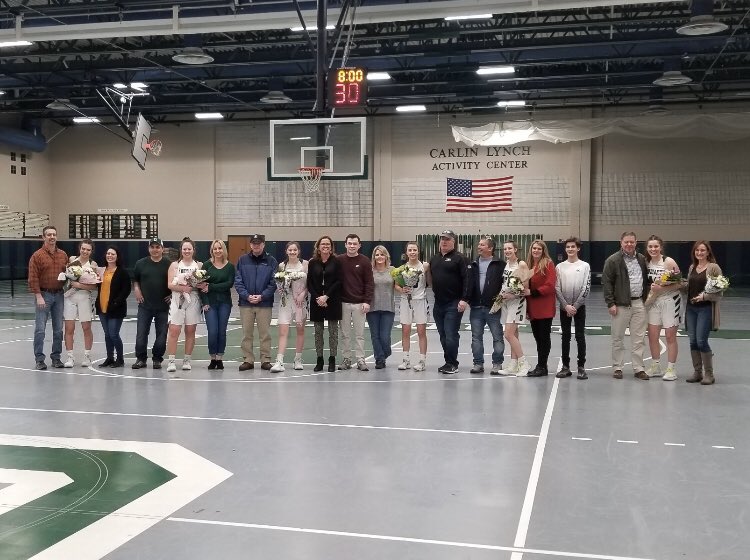 Seniors on the girls varsity basketball team being recognized at Senior Night, before cancellations rained down.