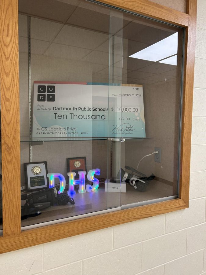 A copy of the grant check is displayed on the A-Floor.