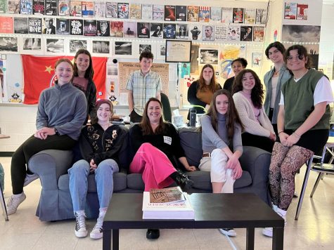 Dr. Shannon Jenkins seated (center) with Editor-in-Chief Avary Amaral (second from left) and the Spectrum Staff.