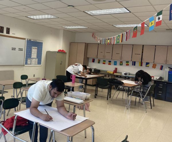 ELL students work on an assignment in Madison Correia's classroom.