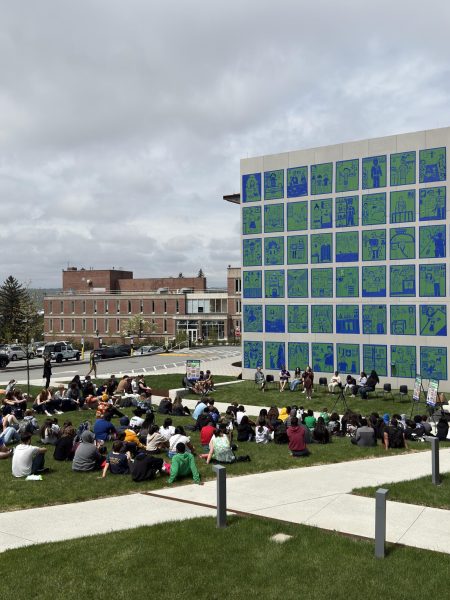 Local artist Michael Townsend taught Holy Cross College students to create Tape Art. They set up an installation on the side of one of the college's buildings.