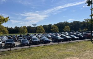 The DHS student parking lot is filled with cars during the school day.